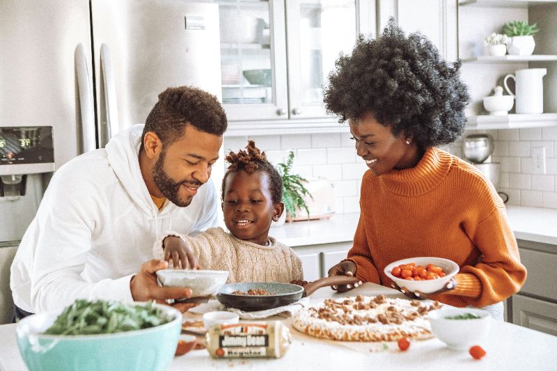 Happy family preparing a meal